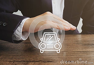 Businessman with the car icon.Car insurance concept Stock Photo