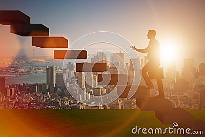 The businessman in career promotion concept with stairs Stock Photo