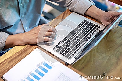 Businessman in casual style working with graph Stock Photo