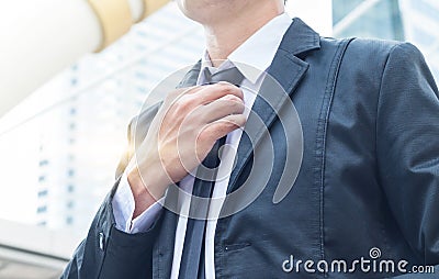 The businessman catch the necktie Stock Photo