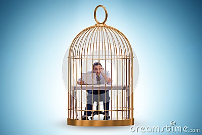 Businessman caught in the cage Stock Photo