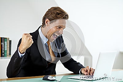 A businessman celebrating a deal Stock Photo