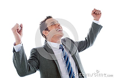 Businessman celebrating success with arms up Stock Photo