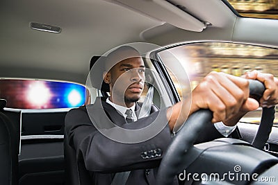 Businessman Chased By Police While Driving Car Stock Photo