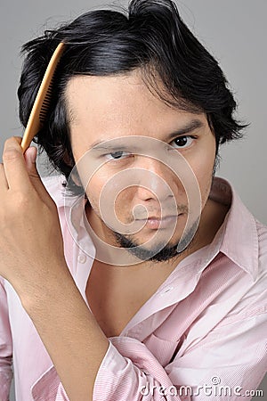 Businessman checking hairline problems Stock Photo