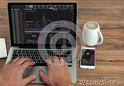 Businessman checking his stock marketing on a laptop, Money forex Trade Graph Chart financial Concept Stock Photo