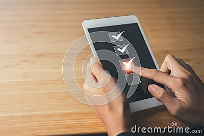 Businessman checking mark the check box. questionnaire and business Stock Photo