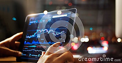 Businessman checking stock market data on tablet Stock Photo