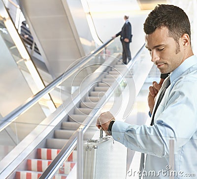 Businessman checking time Stock Photo