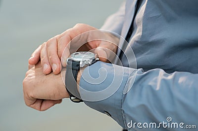 Businessman Checking Time Stock Photo