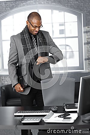 Businessman checking time at office Stock Photo