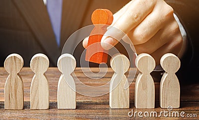 Businessman chooses a person from the team. The best employee, leader. Leadership and promotion. Human Resource Management and Stock Photo