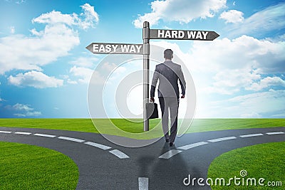 The businessman choosing between hard and easy way Stock Photo