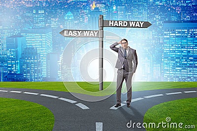 The businessman choosing between hard and easy way Stock Photo