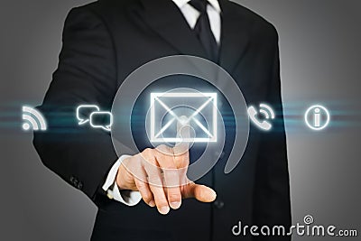 Businessman clicking on email icon Stock Photo