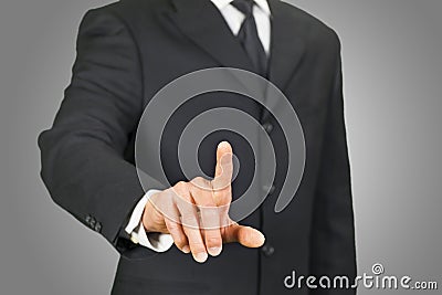 Businessman clicking on touch screen Stock Photo