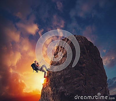 Businessman climb a mountain to get the flag. Achievement business goal and difficult career concept Stock Photo