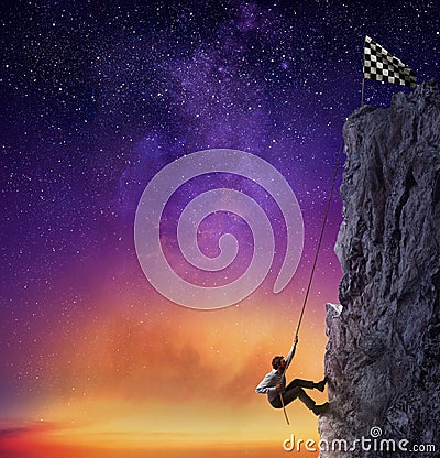 Businessman climb a mountain to get the flag. Achievement business goal and difficult career concept Stock Photo