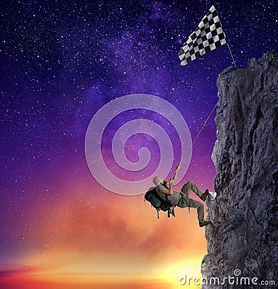 Businessman climb a mountain to get the flag. Achievement business goal and difficult career concept Stock Photo