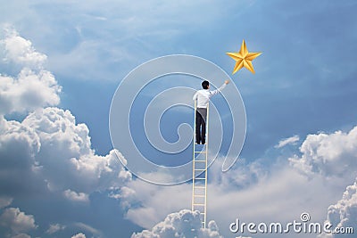 Businessman climb up on ladder to reach star, successful and win concept Stock Photo