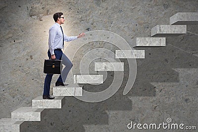 The businessman climbing career ladder in business concept Stock Photo