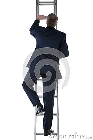 Businessman climbing a ladder Stock Photo