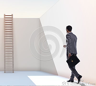 Businessman climbing a ladder to escape from problems Stock Photo