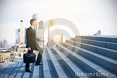 Businessman climbing to success Stock Photo