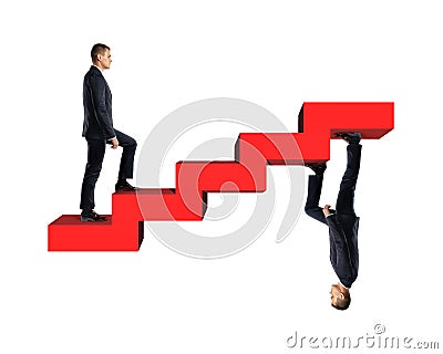 Businessman climbing up model of red stairs with his mirror copy Stock Photo