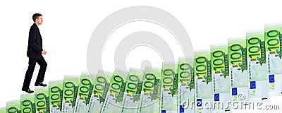 Businessman climbing up stairs of money Stock Photo