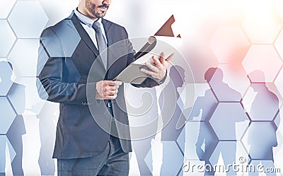Businessman with clipboard and his team Stock Photo