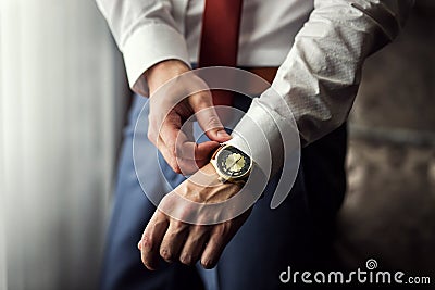 Businessman clock clothes, businessman checking time on his wris Stock Photo
