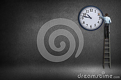 Businessman clock painted on the wall Stock Photo