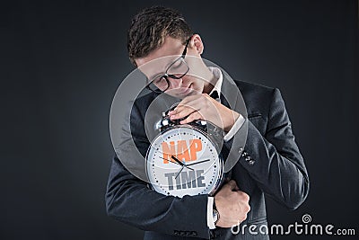 The businessman with clock sleeping in business concept Stock Photo