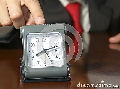 Businessman with a clock Stock Photo