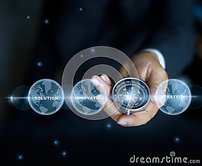 Businessman with a compass holding in hand and text word, stars at night background Stock Photo