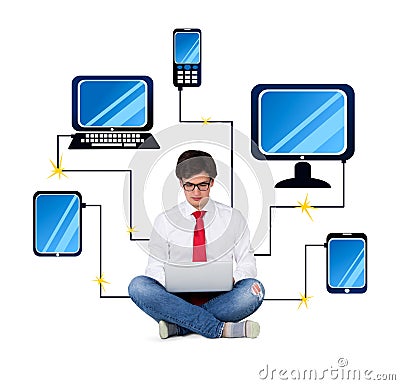 Businessman connected to gadgets Stock Photo