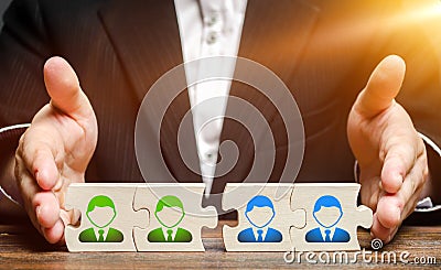 Businessman connects puzzles of workers employees in one group. Creation of an effective team of specialists Stock Photo