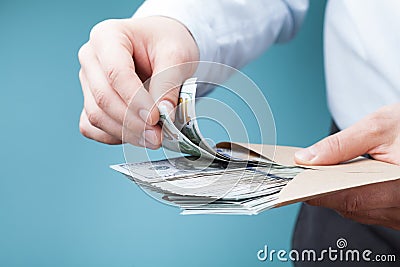 Businessman count money cash in his hand. Economy, saving, salary and donate concept. Stock Photo