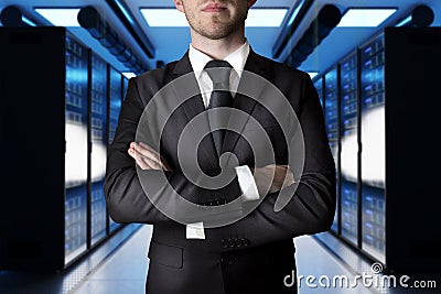 Businessman crossed arms in modern data center with large server, 3D Illustration Stock Photo