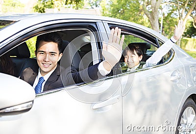 Businessman with daughter driving car go to work and school Stock Photo