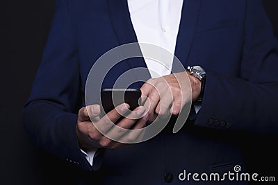 Businessman dialing in the phone Stock Photo