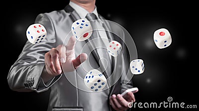 Businessman with dice Stock Photo