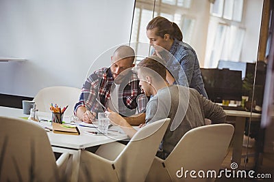 Businessman discussing with colleague during meeting Stock Photo