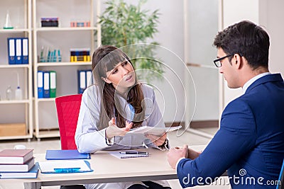 The businessman discussing health issues with doctor Stock Photo