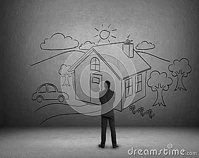 Businessman draw a house on wall Stock Photo