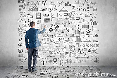 Businessman drawing business plan, graph, chart Stock Photo