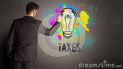 businessman drawing colorful light bulb Stock Photo