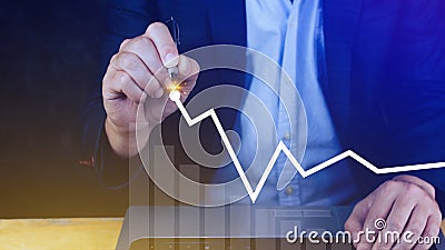 Businessman drawing growth curve, growth forecast chart, bussiness success concept. Hand drawing a graph representing increasing Stock Photo