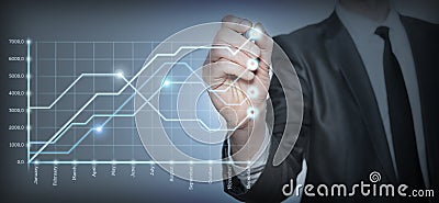 Businessman draws a graph Stock Photo